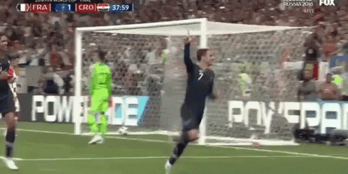 A Soccer Player Is Celebrating After Scoring A Goal During A Game GIF