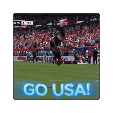 a soccer player is doing a trick on the field with the word go usa behind him
