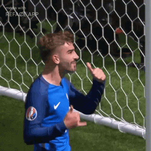 A Soccer Player Is Giving A Thumbs Up In Front Of A Net GIF