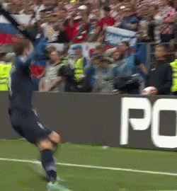 A Soccer Player Is Jumping In The Air On A Field In Front Of A Sign That Says Po GIF