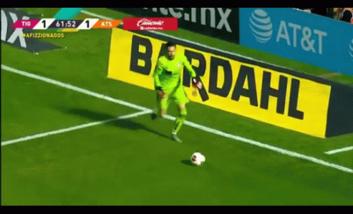Soccer Player Kicking Ball In Front Of Bardahl Sign GIF