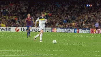 A Soccer Player Is Kicking A Ball In Front Of A Mastercard Banner GIF