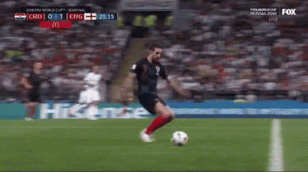 A Soccer Player Is Kicking A Soccer Ball On A Field Sponsored By Mcdonalds GIF