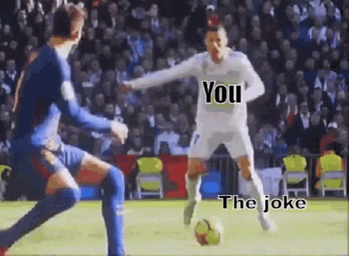 A Soccer Player Is Kicking A Soccer Ball While Another Player Tries To Block Him . GIF