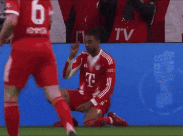 A Soccer Player Is Kneeling On The Field With His Head In His Hand GIF