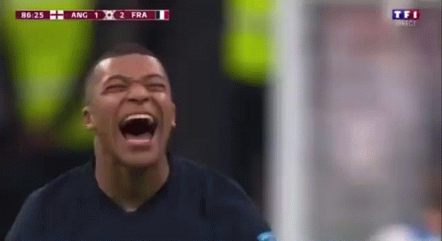 A Soccer Player Is Laughing With His Mouth Open During A Soccer Match . GIF