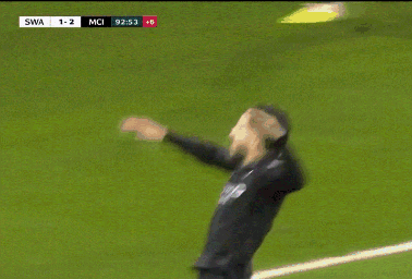 A Soccer Player Is Laying On The Field With The Score 1-2 GIF