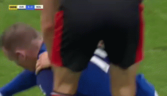 A Soccer Player Is Laying On The Ground With The Score Being 1-0 GIF