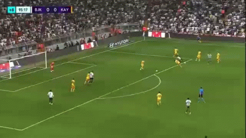 a soccer player is running on a field during a game .