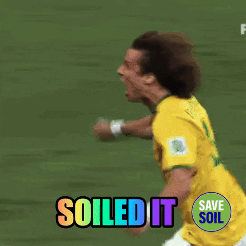 A Soccer Player Is Running On A Field With The Words " Soiled It " Behind Him GIF