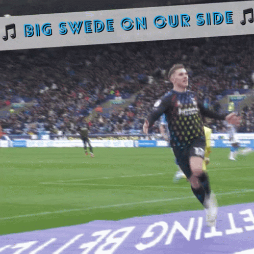 A Soccer Player Is Running On The Field With The Words Big Swede On Our Side Behind Him GIF