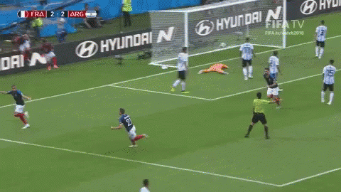 A Soccer Player Is Running Towards A Goal During A Game . GIF