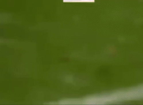 A Soccer Player Is Running Towards A Goal With Dhl Advertisements In The Background GIF