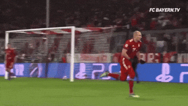 a soccer player is running towards a goal with fc bayern.tv in the corner