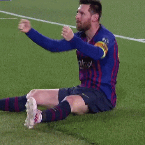 A Soccer Player Is Sitting On The Field With His Arms Outstretched GIF