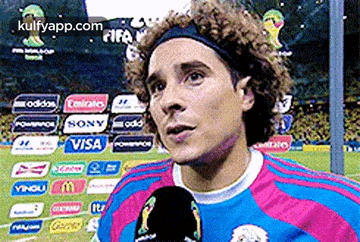 A Soccer Player Is Talking Into A Microphone While Wearing A Headband Sponsored By Visa And Sony GIF