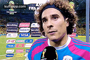 A Soccer Player Is Talking Into A Microphone While Wearing A Headband Sponsored By Visa GIF