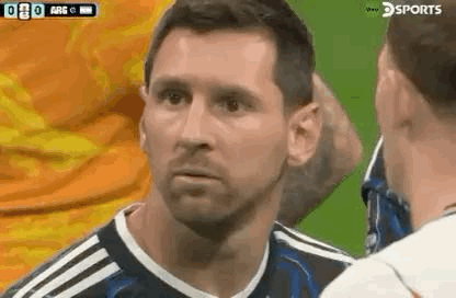 A Soccer Player Is Talking To Another Soccer Player On The Field . GIF