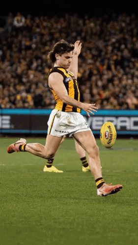 A Soccer Player Kicking A Ball That Says Tigers GIF