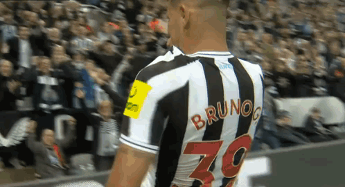 A Soccer Player Named Bruno Is Wearing A Black And White Striped Jersey GIF