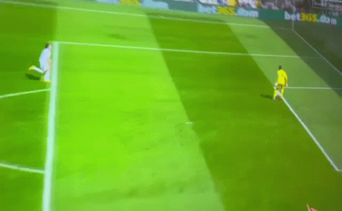 A Soccer Player Runs Towards A Goal With A Banner Behind Him That Says Betsson.com GIF