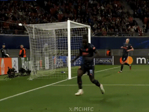 A Soccer Player Runs Towards A Goal With A Watermark That Says X-Mciihfc GIF