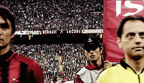 A Soccer Player Stands In Front Of A Banner That Says Bernate On It GIF