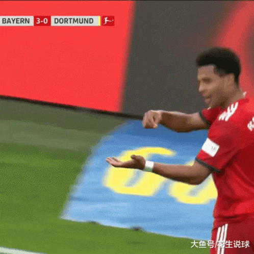 A Soccer Player Stands In Front Of A Scoreboard That Says Bayern 3-0 Dortmund On It GIF