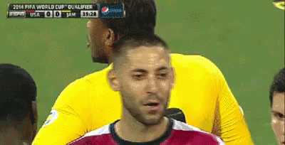 A Soccer Player Stands In Front Of A Scoreboard That Says Fifa World Cup Qualifier On It GIF