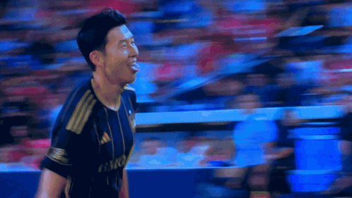 A Soccer Player Stands In Front Of A Scoreboard That Says Lafc GIF