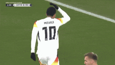 A Soccer Player Stands In Front Of A Sign That Says " Tig " GIF