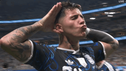 A Soccer Player Wearing A Black Adidas Jersey Holds His Hands To His Head GIF