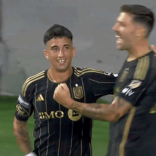 A Soccer Player Wearing A Black And Gold Jersey With Bmc On It GIF