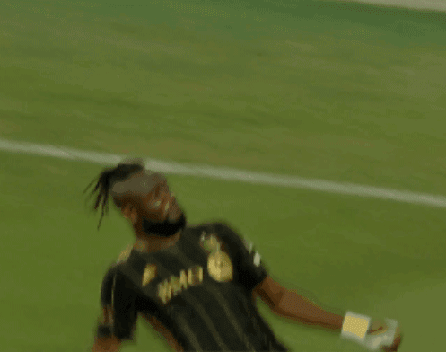 A Soccer Player Wearing A Black And Gold Shirt That Says Bmo On It GIF