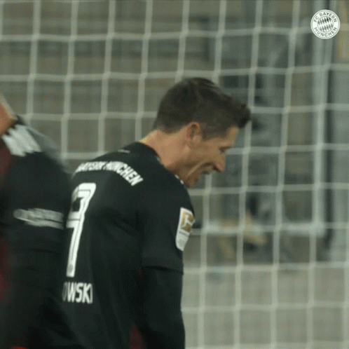 A Soccer Player Wearing A Black Jersey With The Number 7 On The Back GIF