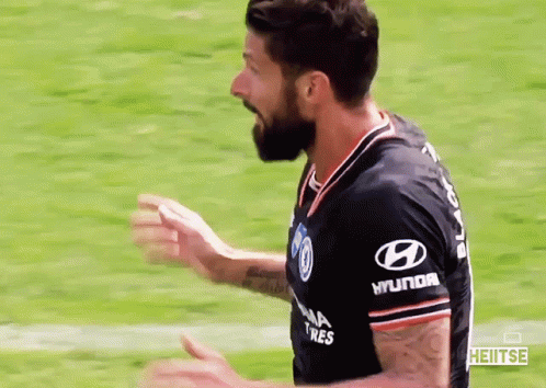 A Soccer Player Wearing A Black Shirt With Hyundai Tires On The Sleeves GIF