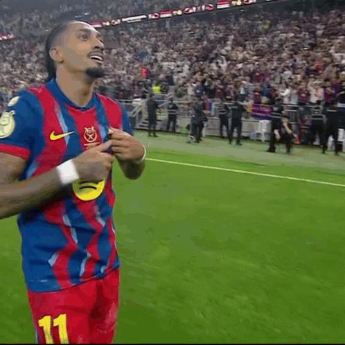 A Soccer Player Wearing A Blue And Red Jersey With The Word Ambr On It GIF