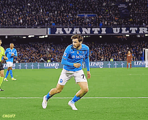 A Soccer Player Wearing A Blue And White Uniform With The Number 7 On It GIF