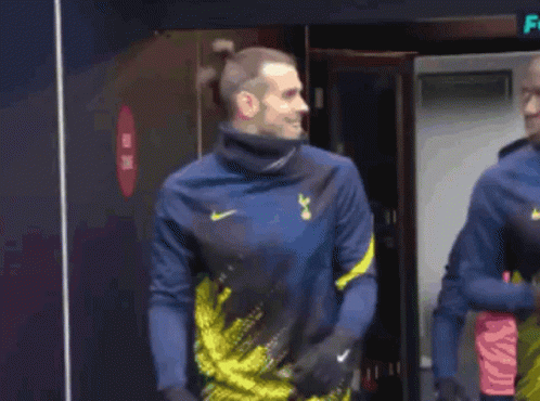 A Soccer Player Wearing A Blue And Yellow Nike Shirt GIF