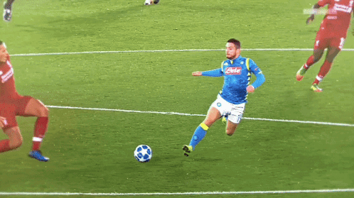a soccer player wearing a blue jersey that says ' napoli ' on it