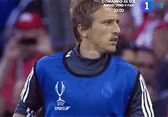 A Soccer Player Wearing A Blue Jersey With A U On It GIF