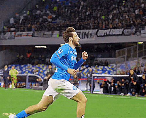 A Soccer Player Wearing A Blue Jersey With Samsung On It Is Running On The Field GIF