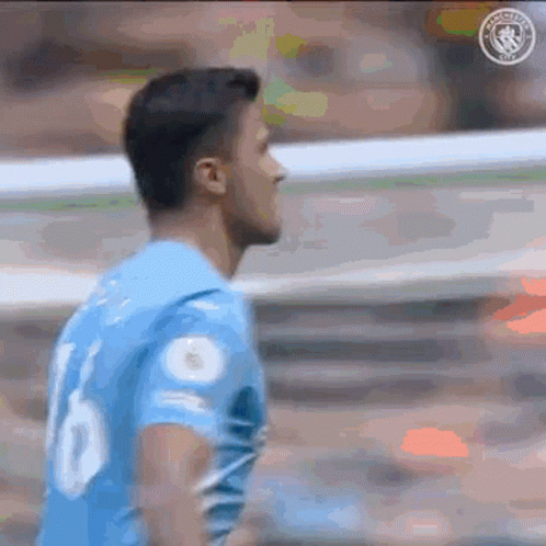 A Soccer Player Wearing A Blue Jersey With The Number 10 On It Is Standing On A Field . GIF