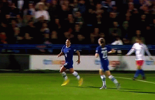 A Soccer Player Wearing A Blue Jersey With The Number 8 On It GIF