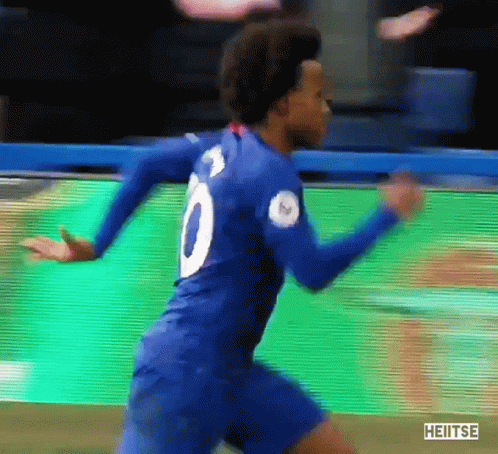 A Soccer Player Wearing A Blue Jersey With The Number 8 On It GIF