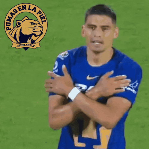A Soccer Player Wearing A Blue Pumas En La Piel Shirt GIF