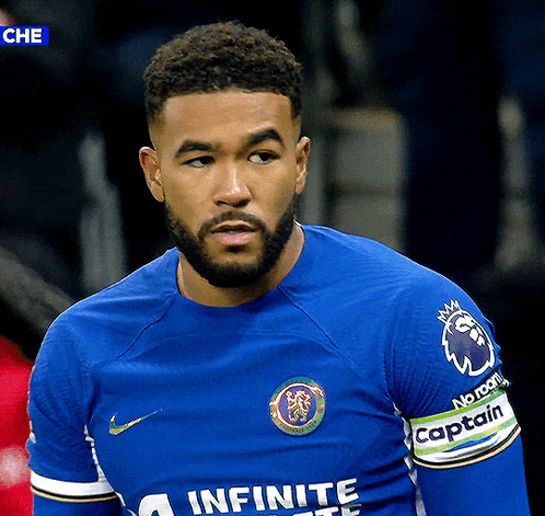 A Soccer Player Wearing A Blue Shirt That Says Infinite GIF