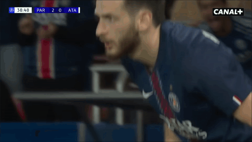 A Soccer Player Wearing A Blue Shirt With The Name Kovatschhelia On It GIF
