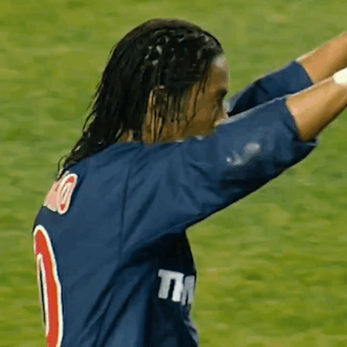 A Soccer Player Wearing A Blue Shirt With The Number 10 On It GIF