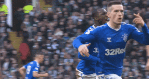 A Soccer Player Wearing A Blue Shirt With The Number 32 On The Front GIF